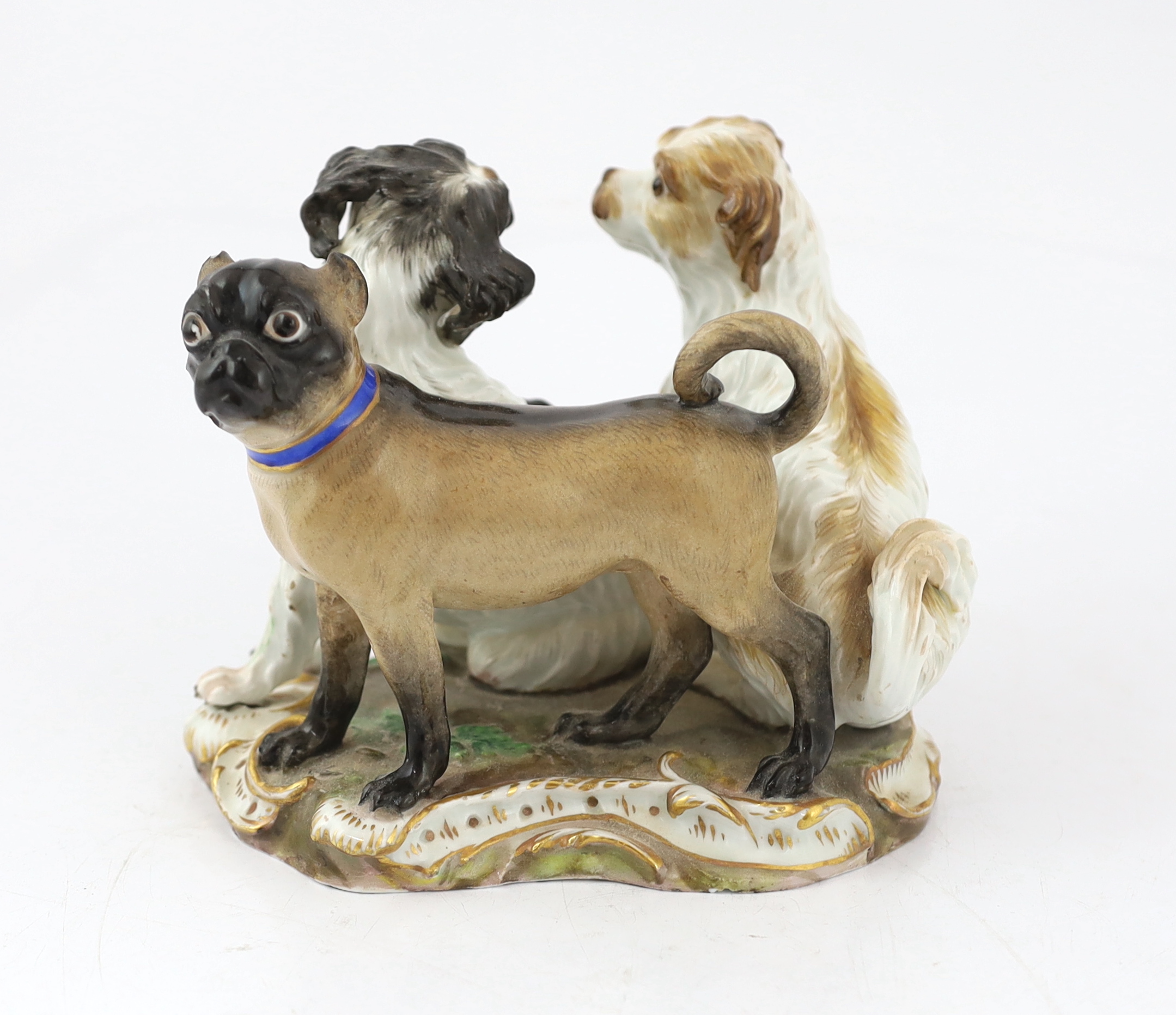 A Meissen group of two terriers and a pug-dog, modelled by Kandler, 19th century